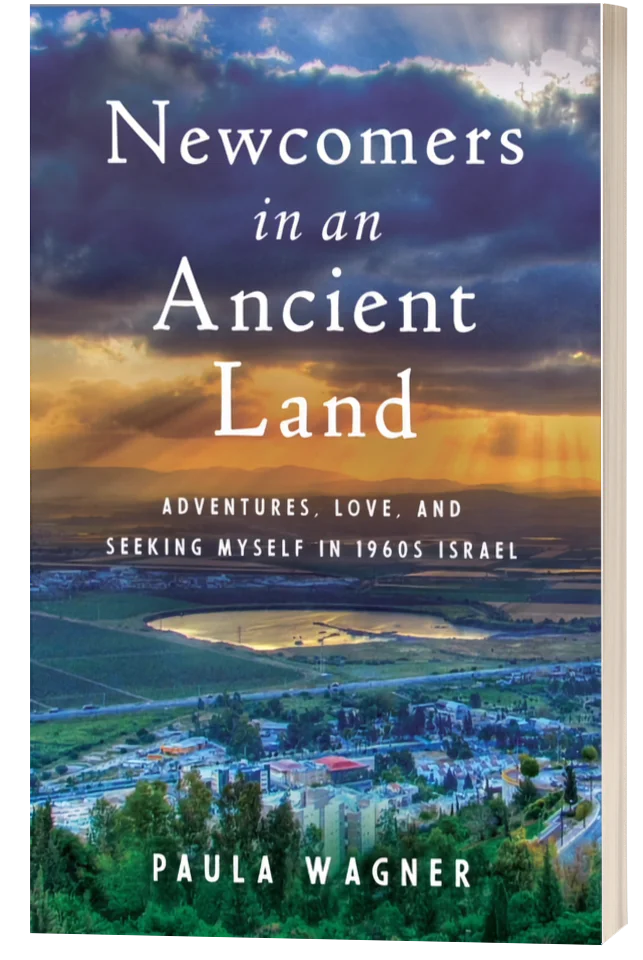 Book cover of Paula Wagner’s memoir “Newcomers in an Ancient Land,” featuring a sunset over the hills of northern Israel.
